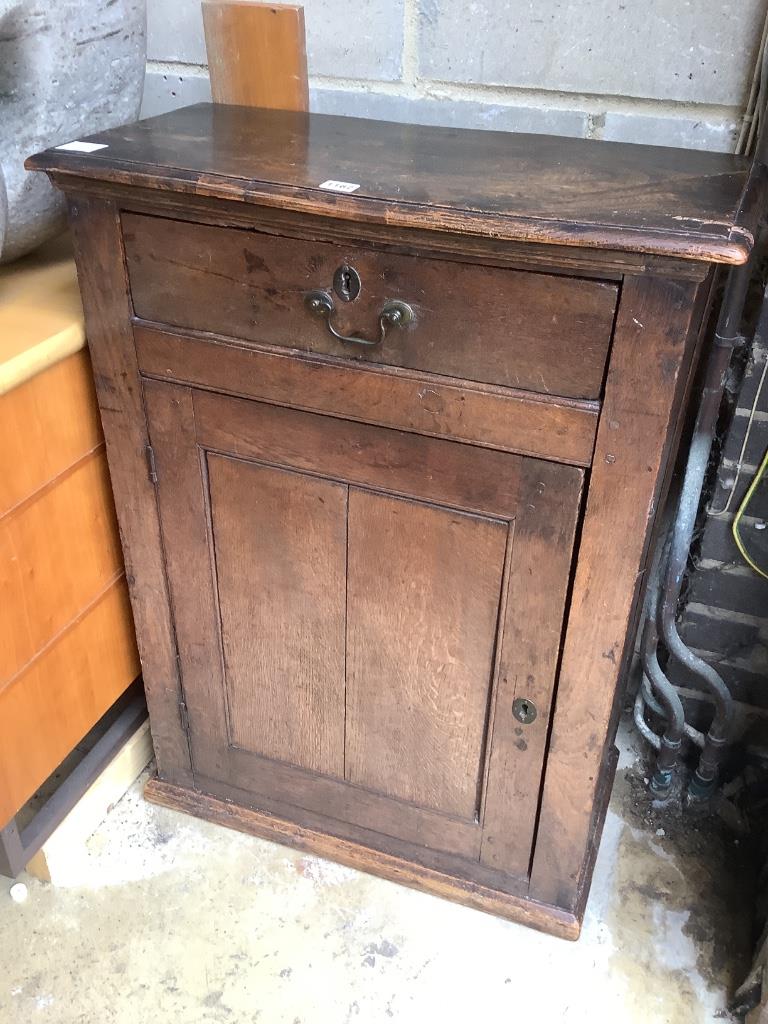 A 17th century Welsh oak single door cupboard, width 67cm, depth 32cm, height 90cm